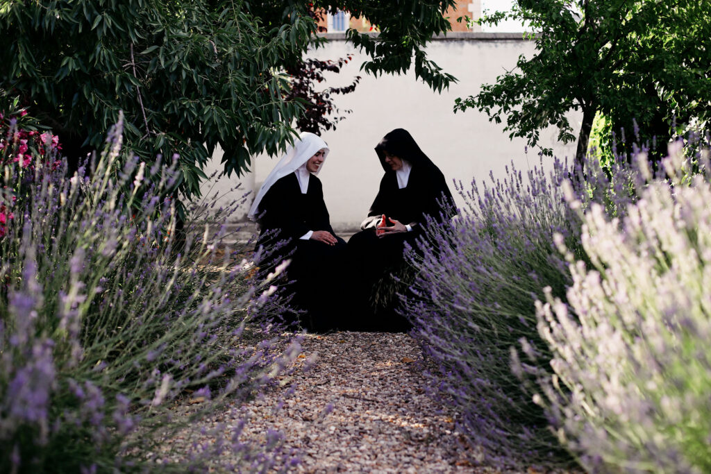 FREE - Two nuns talking in a garden